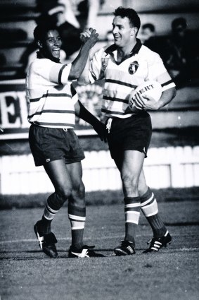 George Gregan and Dave Grimmond congratulate each other after scoring the final try to give the Kookaburras a 22-6 win over the Irish national team in 1994.