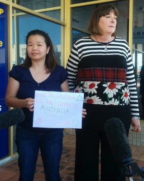 Maria Sevilla and Queensland Nurses Union secretary Beth Molle deliver a petition to federal Health Minister Peter Dutton's office.