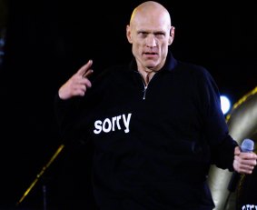 Peter Garrett performs with Midnight Oil at the closing ceremony of the Sydney Olympics.