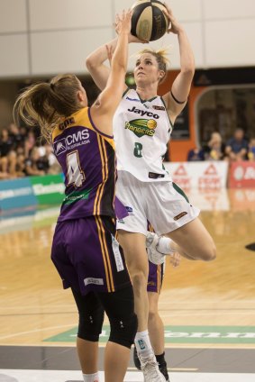 Ranger Steph Cumming fires over Boomer Olivia Thompson at the State Basketball Centre in a 78-66 win for Dandenong.
