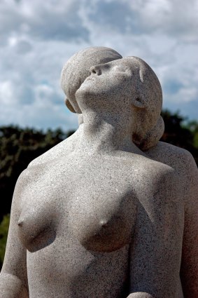 A giantess sunbathes at Vigeland Sculpture Park.