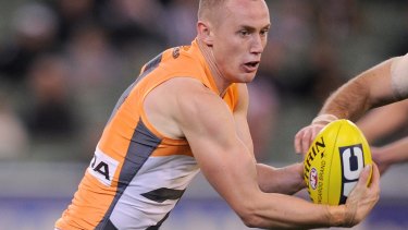 The Giants' Tom Scully in action at the MCG.