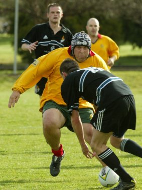 Joe Hockey playing rugby.