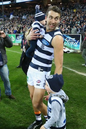Corey Enright walks out with his kids for his 326th game for the Cats, a club record. 
