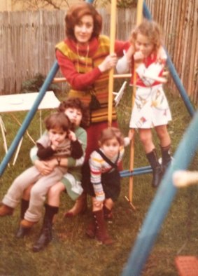 Gladys Berejiklian, in green, holds her cousin Sima, with her Aunty Sonya, her sisters Mary and Rita.