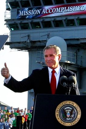 George W. Bush flashes a "thumbs-up" after declaring the end of major combat in Iraq on board the aircraft carrier USS Abraham Lincoln in May 2003. Daniel Dusek served with distinction in Iraq.