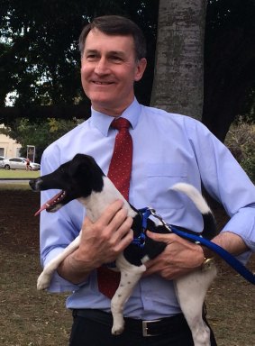 Brisbane Lord Mayor Graham Quirk with Holly, the latest member of the BCC rodent control team.