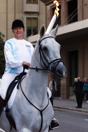 Olympic gold medalist Gillian Rolton on her beloved horse Fred takes the torch on its first leg of the Olympic torch relay in Adelaide ahead of the 2000 Sydney games. 