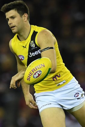 Tigers captain Trent Cotchin has gone on report for striking St Kilda's Jack Lonie.