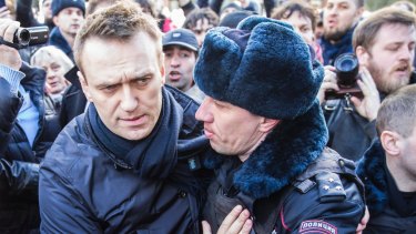 Alexei Navalny is detained by police in downtown Moscow.