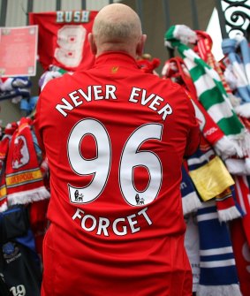 Liverpool fans pay their respects at the Hillsborough memorial at Anfield on April 15, 2009.
