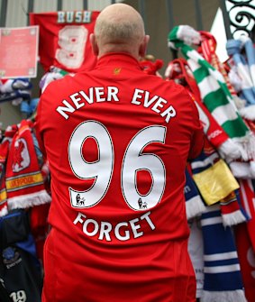 Liverpool fans pay their respects at the Hillsborough memorial at Anfield on April 15, 2009.