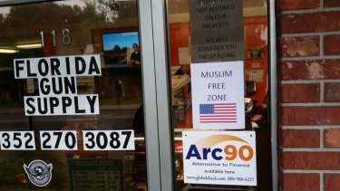 A sign at Florida Gun Supply in Inverness, Florida, declares the store a "Muslim-Free Zone". 