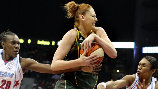 Seattle Storm center Lauren Jackson, center, of Australia, keeps the ball from Atlanta Dream's Sancho Lyttle (20) and Iziane Castro Marques, of Brazil, during the first quarter of Game 3 of the WNBA basketball finals Thursday, Sept. 16, 2010, in Atlanta. (AP Photo/John Bazemore)