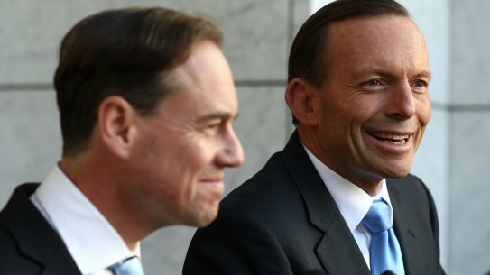 Tony Abbott, with his former environment minister Greg Hunt, says climate change "might even be beneficial".