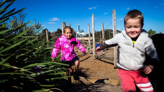 Anna, 6, and Xavier, 4, at the Royal Park Nature Play playground. 