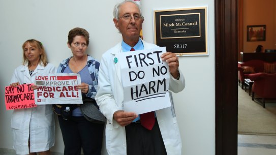 Retired family physician Jay Brock of Fredericksburg, Virginia, joins protests  outside the office of Senate Majority Leader Mitch McConnell on Monday.
