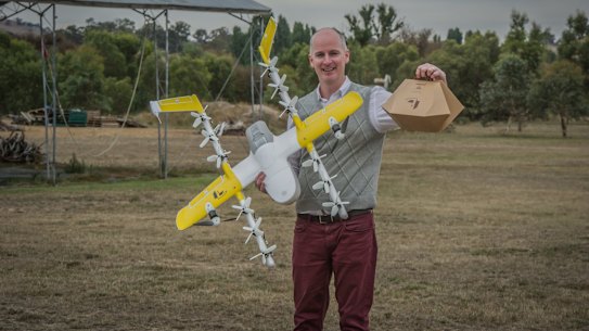 Project Wing has been developing a drone delivery service for Tuggeranong, delivering hot meals and chemist supplies. Delivery project manager Luke Barrington takes delivery of a hot lunch from Guzman Y Gomez.