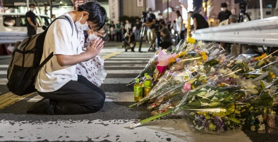 NARA JAPAN - JULY 08: People pray at a site outside of Yamato-Saidaiji Station where Japanâs former prime minister Shinzo Abe was shot earlier today during an election campaign on July 08, 2022 in Nara, Japan. Former Prime Minister Abe has been pronounced dead, he collapsed after shots were heard while he was campaigning at a rally. A suspect was apprehended and taken into custody, as Abe was rushed to a hospital via helicopter. (Photo by Yuichi Yamazaki/Getty Images) *** BESTPIX ***