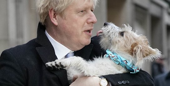 LONDON, UNITED KINGDOM - DECEMBER 12: Prime Minister Boris Johnson poses outside Methodist Hall polling station as he casts his vote with dog Dilyn, on December 12, 2019 in London, England. The current Conservative Prime Minister Boris Johnson called the first UK winter election for nearly a century in an attempt to gain a working majority to break the parliamentary deadlock over Brexit. The election results from across the country are being counted overnight and an overall result is expected in the early hours of Friday morning. (Photo by Christopher Furlong/Getty Images) *** BESTPIX ***