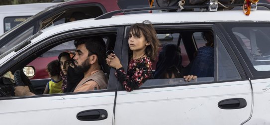 KABUL, AFGHANISTAN - AUGUST 10 : Displaced Afghans head into Kabul from the northern provinces desperately leaving their homes behind on August 10, 2021 in Kabul, Afghanistan. People displaced by the Taliban advancing are flooding into the Kabul capital to escape the Taliban takeover of their provinces. (Photo by Paula Bronstein /Getty Images)