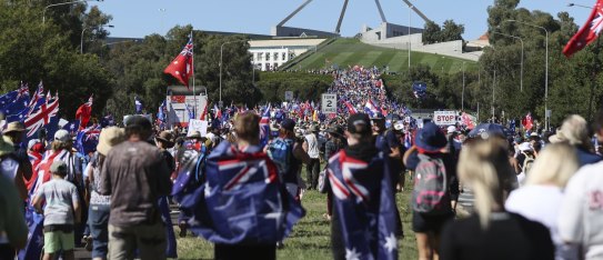 'Convoy to Canberra' protestors marching towards the Parliarmentary triangle, in Canberra on Saturday fedpol Photo: Alex Ellinghausen