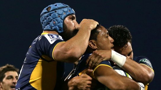 Christian Lealiifano of the Brumbies celebrates scoring a try with team mates during the round two NRL match between the Brumbies and the Waratahs at GIO Stadium on March 4. 