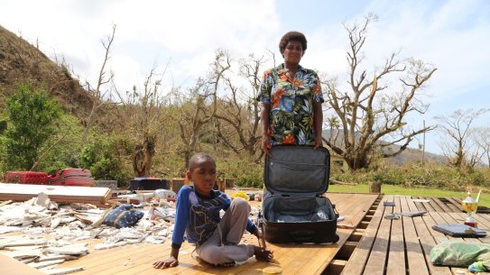 Salome Ululagi stands in the remains of her house destroyed by Tropical Cyclone Winston in Tavua Village, Koro Island, Fiji.   
