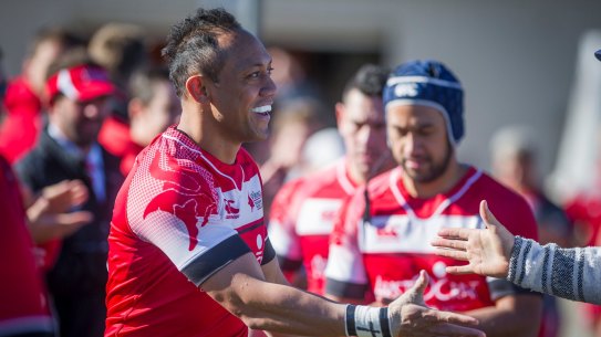 Christian Lealiifano running on to the field for his Canberra rugby comeback, with brother Lix following.