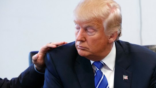 Art Del Cueto, a vice president for the National Border Patrol Council, puts his hand on Donald Trump's shoulder during a security meeting at Trump Tower on Friday.
