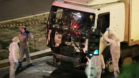Authorities investigate a truck after it ploughed through Bastille Day revellers in the French resort city of Nice on Thursday.