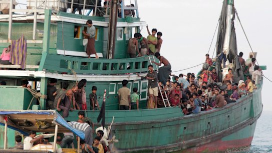 Rohingya and Bangladeshi refugees await rescue by  Acehnese fishermen off East Aceh, Indonesia, in May.