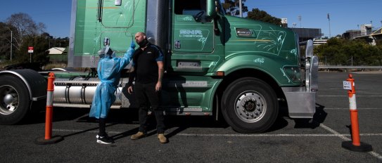Truck driver Mick Cummings having a COVID test at the Leumeah Drive through COVID-19 testing clinic. He works at a truck depot in Campbelltown and lives in the Southern Highlands, he is required to have a COVID test every three days, his work takes him interstate. Campbelltown LGA during Lockdown. COVID-19 Coronavirus. 30th July 2021 Photo Louise Kennerley . contact 0404589318
SMH