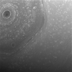 The Cassini spacecraft has filmed a strange hexagon-shaped storm spinning over the northern hemisphere of Saturn.