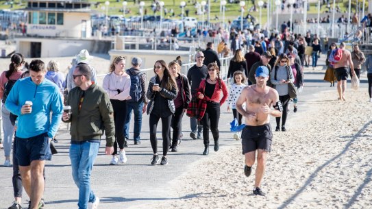 A very busy day at Bondi along the promenade and grassy areas, although the sand and water were much less crowded. 19th July 2020. Photo: Edwina Pickles / SMH coronavirusÂ COVID-19