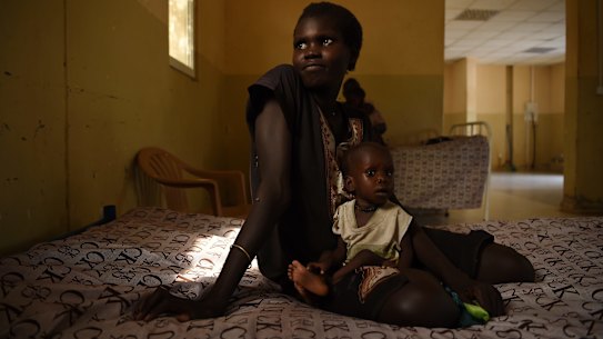 Nyereka Maliyah 20yrs with her baby Dictor Geng 1yrs who is ill and being treated at the CARE Stabalization point at Bentiu hospital, Bentiu, Unity State, South Sudan. 