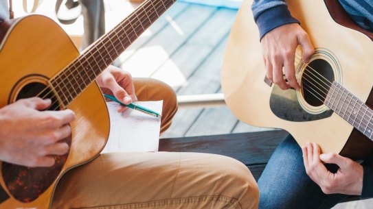 A hobby such as playing the guitar can form the basis of a 'side hustle'.