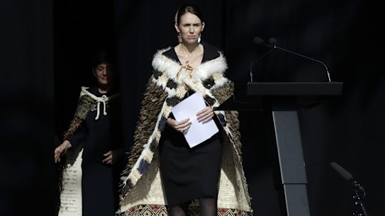 New Zealand Prime Minister Jacinda Ardern walks onto the stage to address a national remembrance service in Hagley Park.