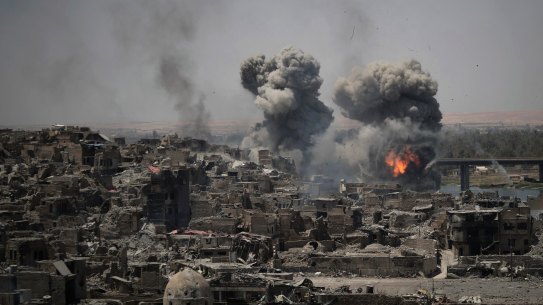 Airstrikes target Islamic State positions on the edge of the Old City in Mosul, Iraq in July. 