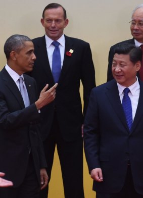 Lonely stand: Prime Minister Tony Abbott stands behind US President Barack Obama and Chinese Present Xi Jinping.