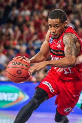 Bryce Cotton of the Wildcats dribbles the ball during the Round 18 NBL match between the Perth Wildcats and the Cairns Taipans at the Perth Arena in Perth, Friday, February 9, 2018. (AAP Image/Tony McDonough) NO ARCHIVING, EDITORIAL USE ONLY