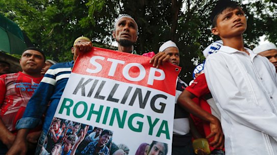 A Rohingya holds a banner during a protest after Friday prayers outside the Myanmar embassy in Kuala Lumpur, Malaysia, in November.