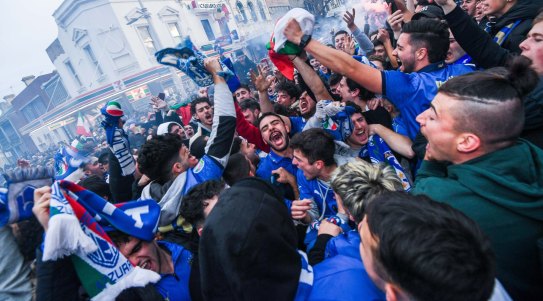 Italian soccer fans celebrate in Lygon Street.