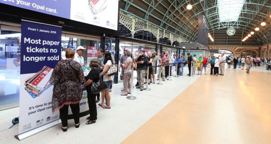 Commuters queue to buy Opal cards as paper tickets are phased out. 