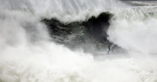 A surfer is seen braving strong swell at Tamarama in Sydney, Saturday, 2 April, 2022. Surf and swell conditions are expected to be hazardous for coastal activities such as rock fishing, boating, and swimming across the easternc coast this morning by the Bureau of Meterology.Â Pic - John Tanner