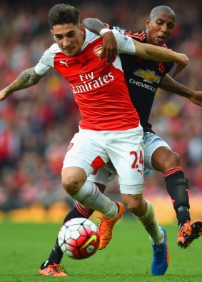 Hector Bellerin of Arsenal holds off Manchester United's Ashley Young.