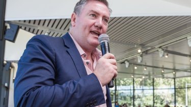 Eddie McGuire has called for those behind the anti-Muslim banner to be banned for life.