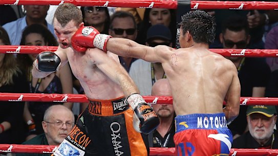 On the ropes: Jeff Horn wore several vicious shots from Manny Pacquiao throughout the ninth round. 