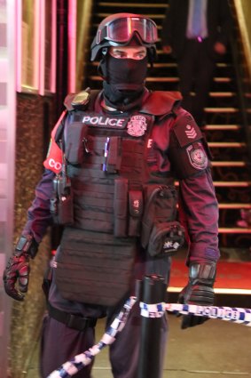 A police officer is pictured outside Bada Bing Nightspot.