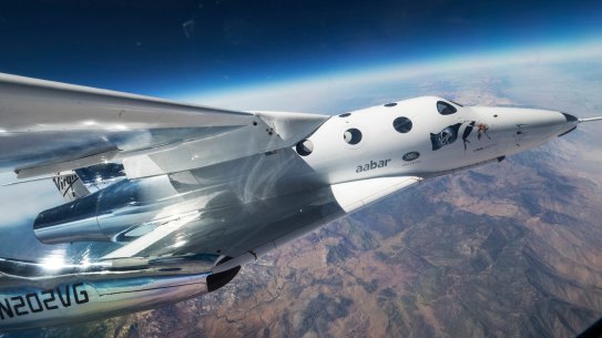 Virgin Galactic’s spaceship VSS Unity glides over California’s Mojave desert during its first flight last year.